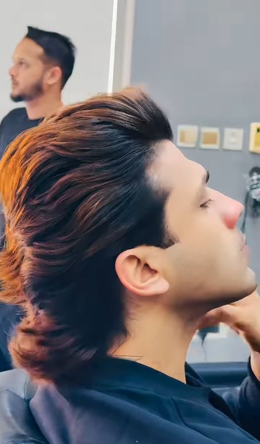 A client mid-cut in the chair